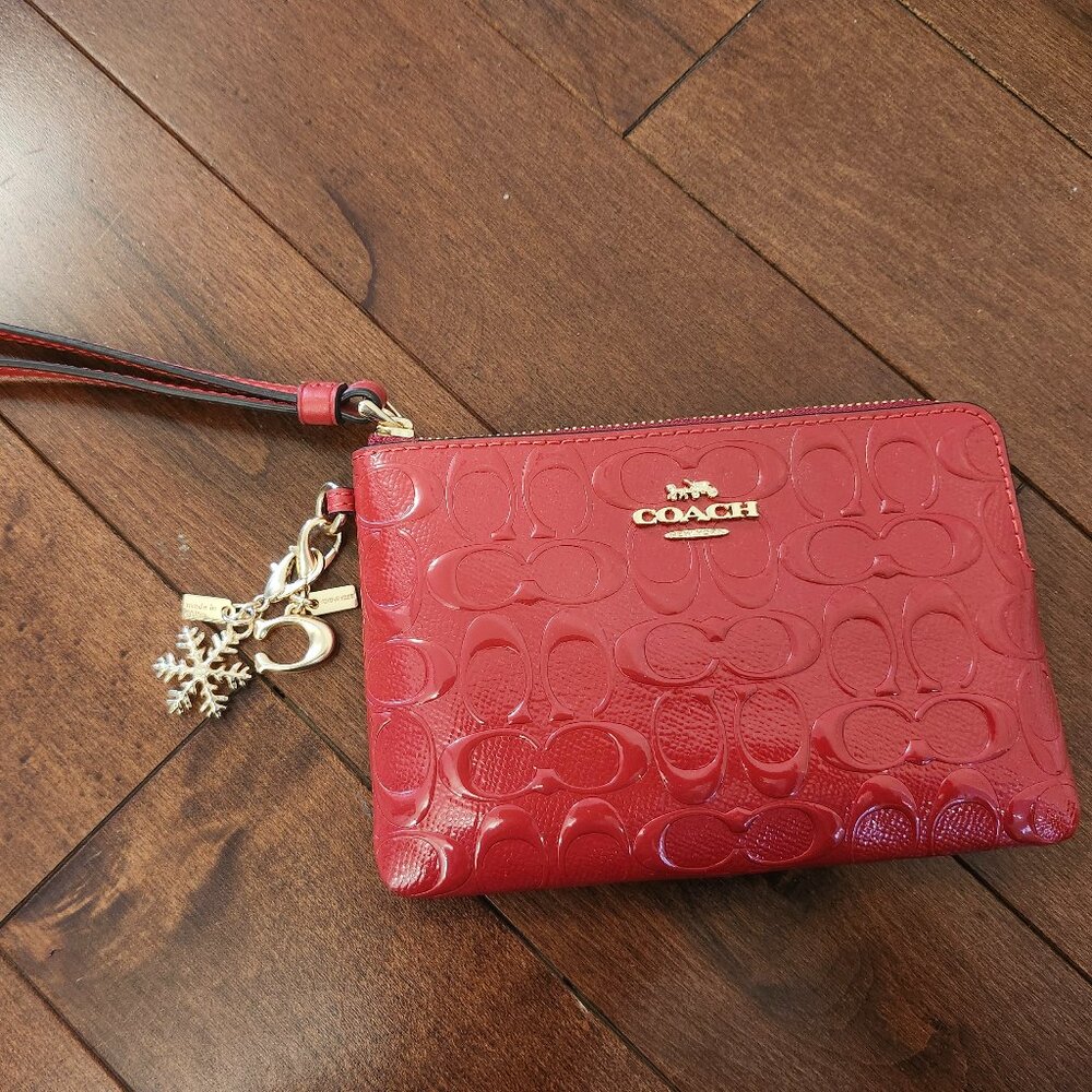 Coach red wristlet with charm